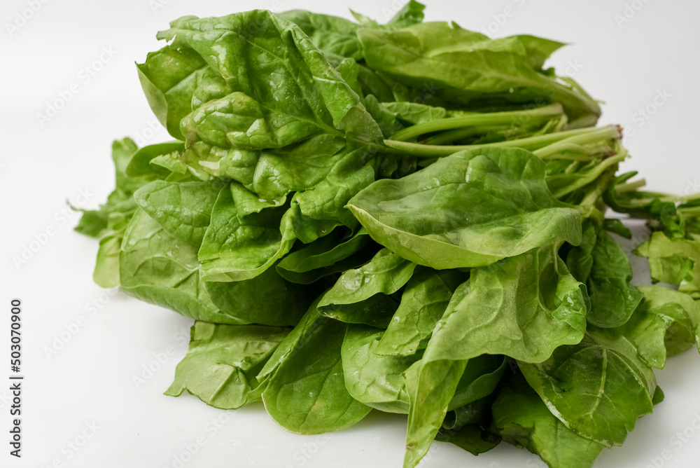 Fresh spinach leaves on white isolated background Fresh spinach leaves on white isolated background