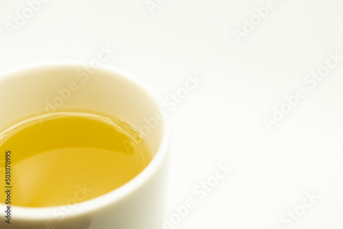 Green tea on a white background. Image of Japanese green tea. Cup of tea isolated on white background