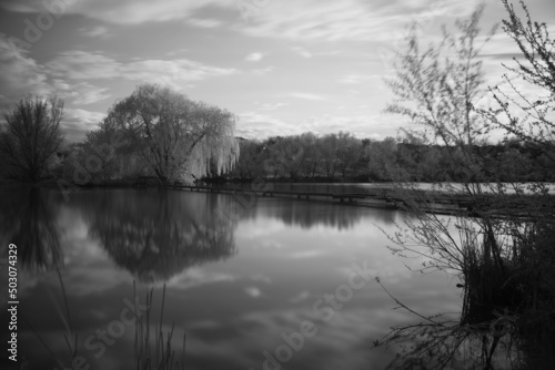 Beautiful black and white landscape of the lake in the village