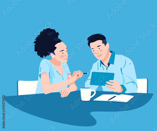 Young man and woman discussing work over a cup of coffee sitting in the office. Business colleagues using a tablet pc while discussing business financials illustrations. (ID: 503074972)