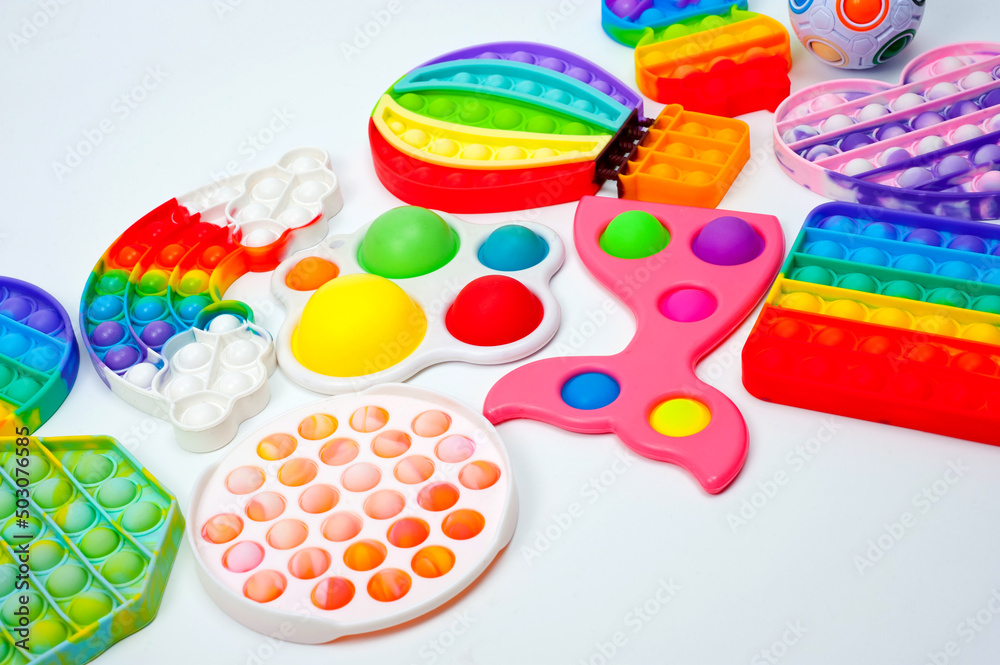Rainbow bubble toys in different shapes to relieve stress.