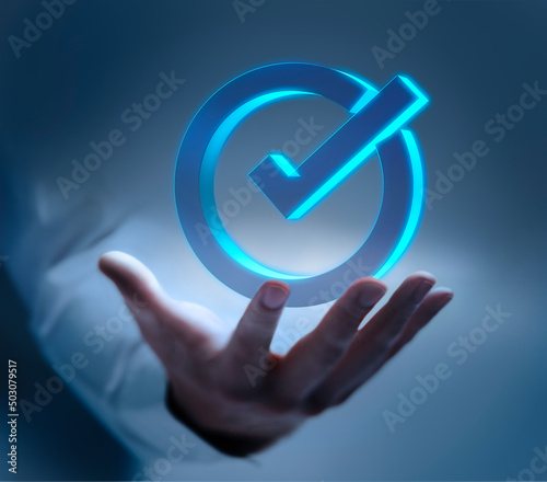 Male hand showing check mark icon with dark background - 3D illustration photo