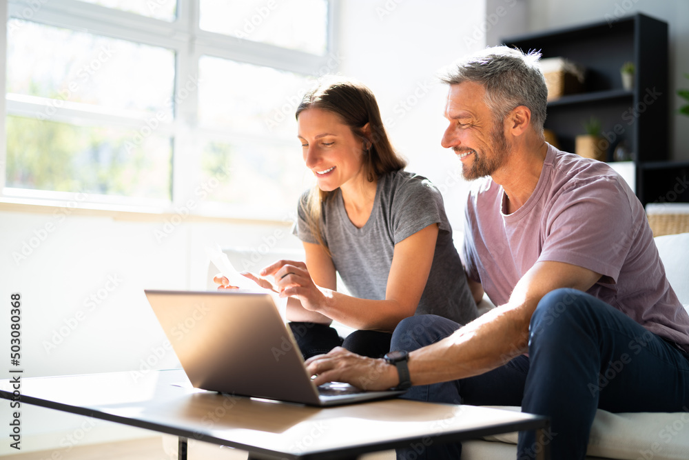 Couple Doing Taxes And Family Budget Couple Doing Taxes And Family Budget