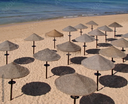 Tropical bast sun umbrellas on the Algarve coast - Portugal  © insideportugal