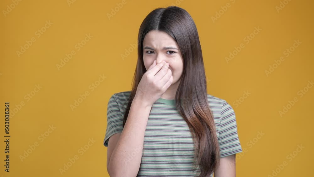 Schoolkid not like awful smell reject isolated shine color background Schoolkid not like awful smell reject isolated shine color background
