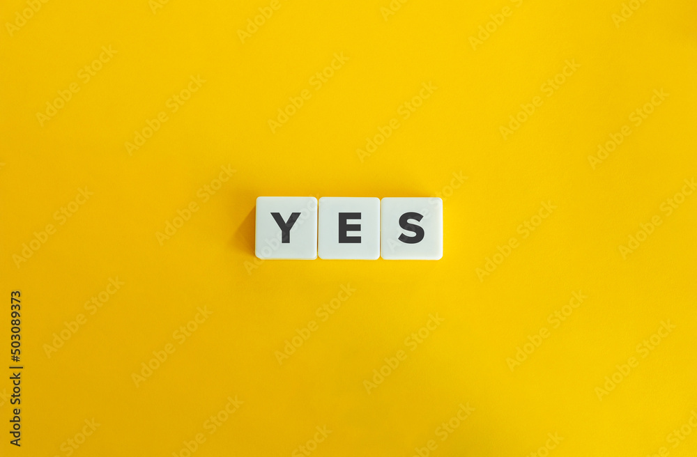 Yes Word on Letter Tiles on Yellow Background. Minimal Aesthetics. Yes Word on Letter Tiles on Yellow Background. Minimal Aesthetics.