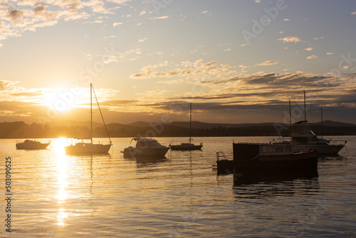 boats on the lake at sunset © Christina