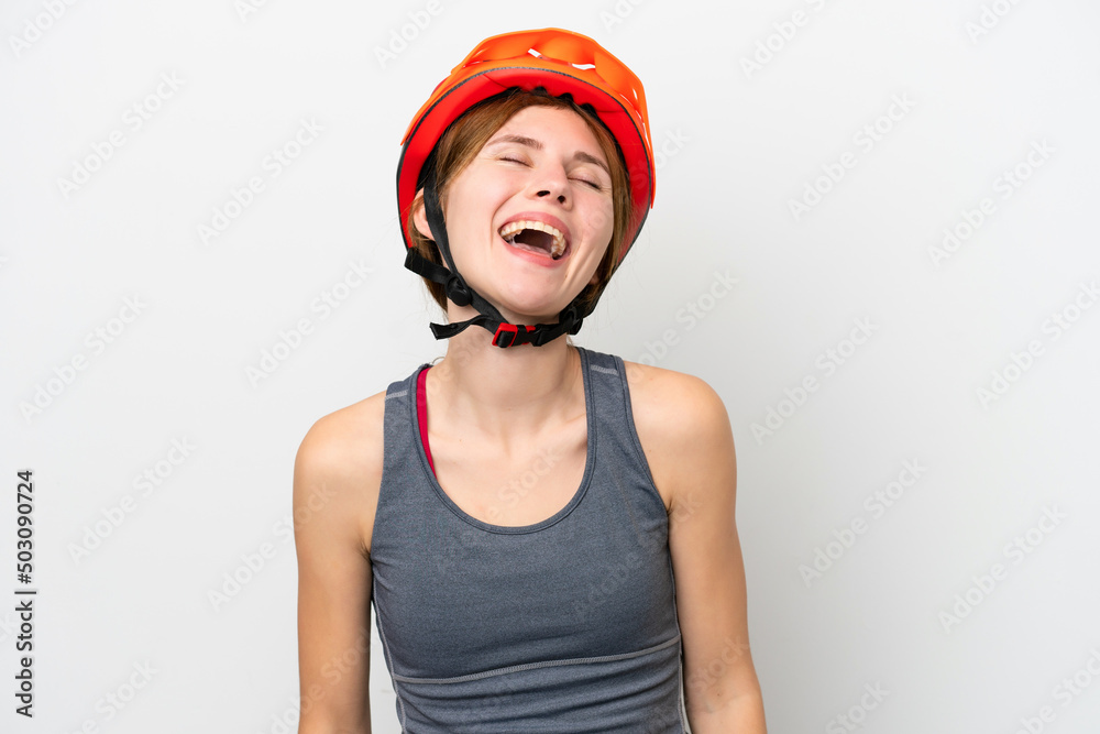 Young cyclist English woman isolated on white background laughing Young cyclist English woman isolated on white background laughing