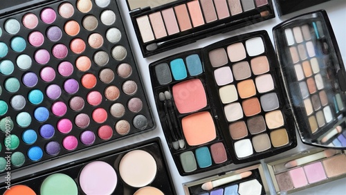 Collection of various cosmetic products. Make up eyeshadow palettes. 