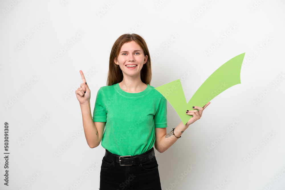 Young English woman isolated on white background holding a check icon and pointing up Young English woman isolated on white background holding a check icon and pointing up