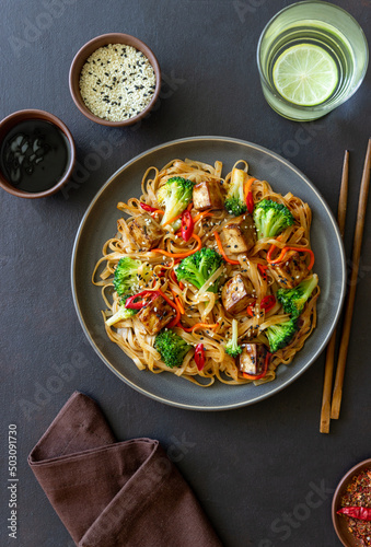 Udon noodles with tofu, broccoli, carrots, pepper and sesame. Healthy eating. Vegetarian food. Asian food.
