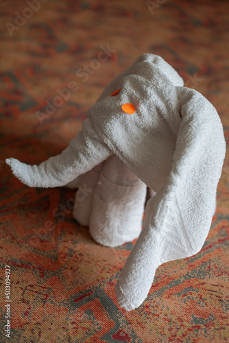 close up of an elephant made from a towel in a hotel photo