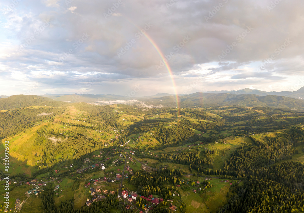 Aerial drone view. Rainbow in the mountains of the Ukrainian Carpathians.
