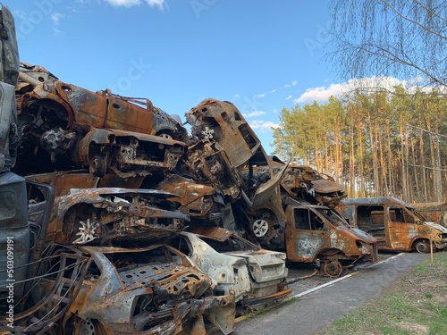 Burnt and blown up car. Traces of shots on the body of the car. Cars damaged after shelling. War between Russia and Ukraine, Irpin-Bucha, April 10, 2022