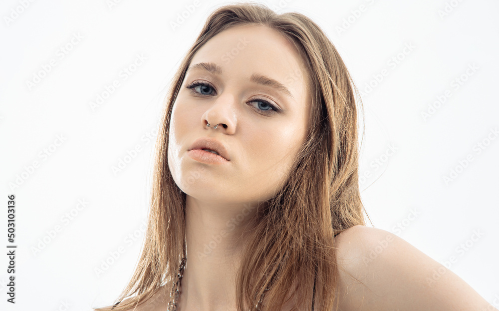 Portrait beautiful model posing in studio over grey background. Caucasian portrait woman. Portrait beautiful model posing in studio over grey background. Caucasian portrait woman.