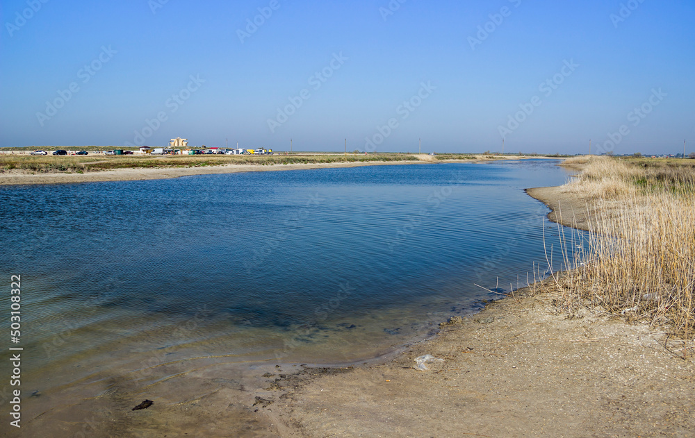 a shallow salty lagoon near the Azov sea on the Arabat Spit, Ukraine a shallow salty lagoon near the Azov sea on the Arabat Spit, Ukraine
