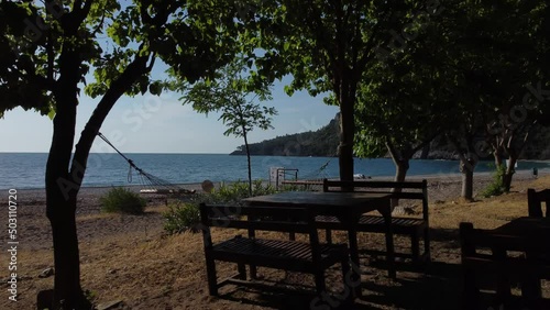 Beautiful Mediterranean restaurant on the beach on a sunny morning. High quality 4k footage