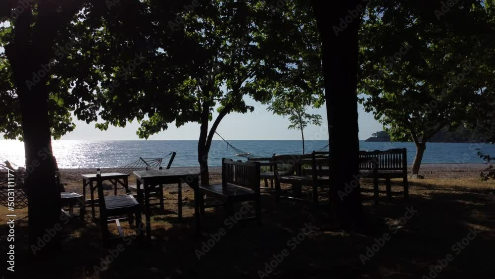 Beautiful Mediterranean restaurant on the beach on a sunny morning. High quality 4k footage Beautiful Mediterranean restaurant on the beach on a sunny morning. High quality 4k footage