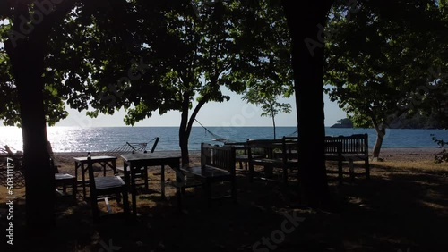 Beautiful Mediterranean restaurant on the beach on a sunny morning. High quality 4k footage