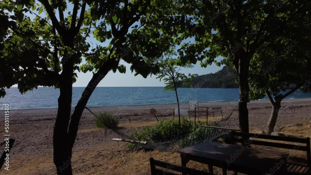 Beautiful Mediterranean restaurant on the beach on a sunny morning. High quality 4k footage Beautiful Mediterranean restaurant on the beach on a sunny morning. High quality 4k footage