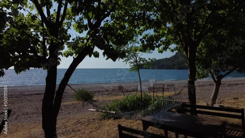 Beautiful Mediterranean restaurant on the beach on a sunny morning. High quality 4k footage