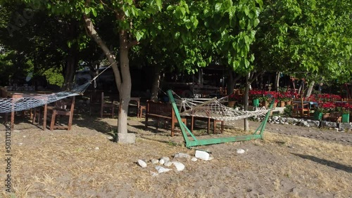 Beautiful Mediterranean restaurant on the beach on a sunny morning. High quality 4k footage