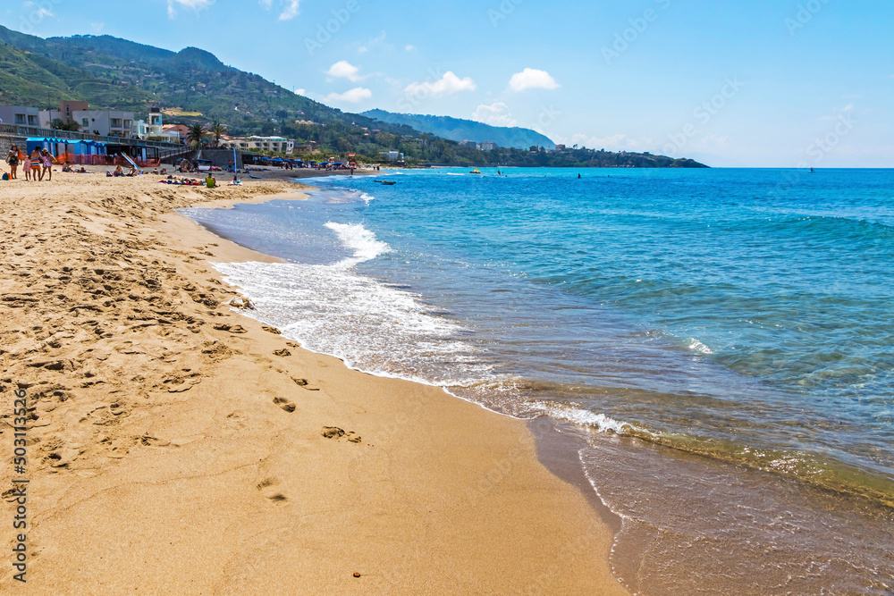 Golden sand of Cefalu beach, Cefalu town, Sicily, Italy. Cefalu has a long and lovely beach with clean, golden sand