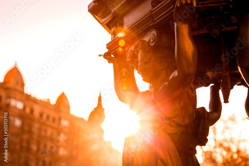 Cast iron public fountain with caryatid female figures in Barcelona