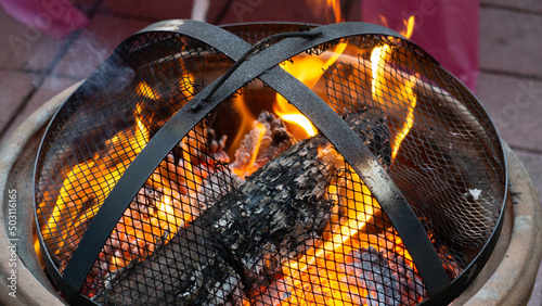 close up of a burning stove in a fireplace