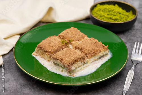 Cold baklava. Baklava with milk on a dark background. Mediterranean cuisine delicacies. Close-up. Local name soguk baklava