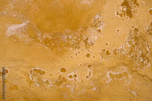 Yellow painted weathered wall texture