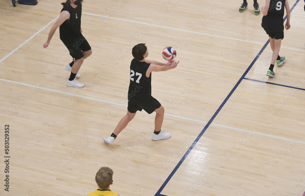Volleyball player passes a free ball during a sixes game