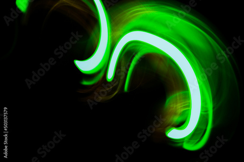 Futuristic bright lime green fiber abstract lights on a dark background photo