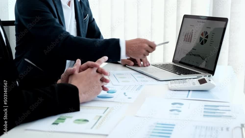 Business meeting, Businessman is summarizing financial graphs and analyzing market trends from a laptop to develop a company's revenue, Brainstorming or Discussing concept. Business meeting, Businessman is summarizing financial graphs and analyzing market trends from a laptop to develop a company's revenue, Brainstorming or Discussing concept.