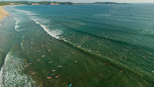 Wallpaper Mural Surfers with boards in the water waiting for the waves in the ocean, top shot, drone photo. Torontodigital.ca