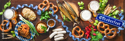 Fotobehang Festive served table with Bavarian specialities. Oktoberfest menu