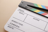 Movie clapper board against yellow background 