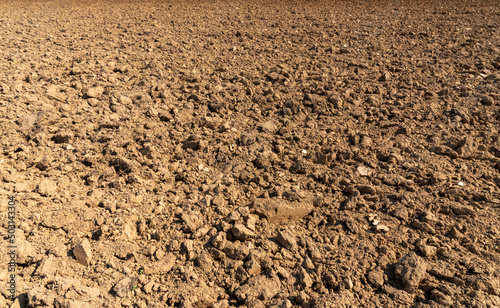 Plowed land with large clods, dry plowed soil. Ideal texture fo background