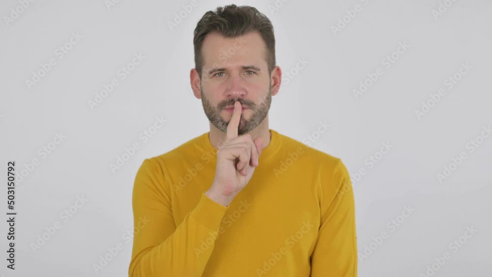 Portrait of Middle Aged Man Showing Quiet Sign by Finger on Lips Portrait of Middle Aged Man Showing Quiet Sign by Finger on Lips