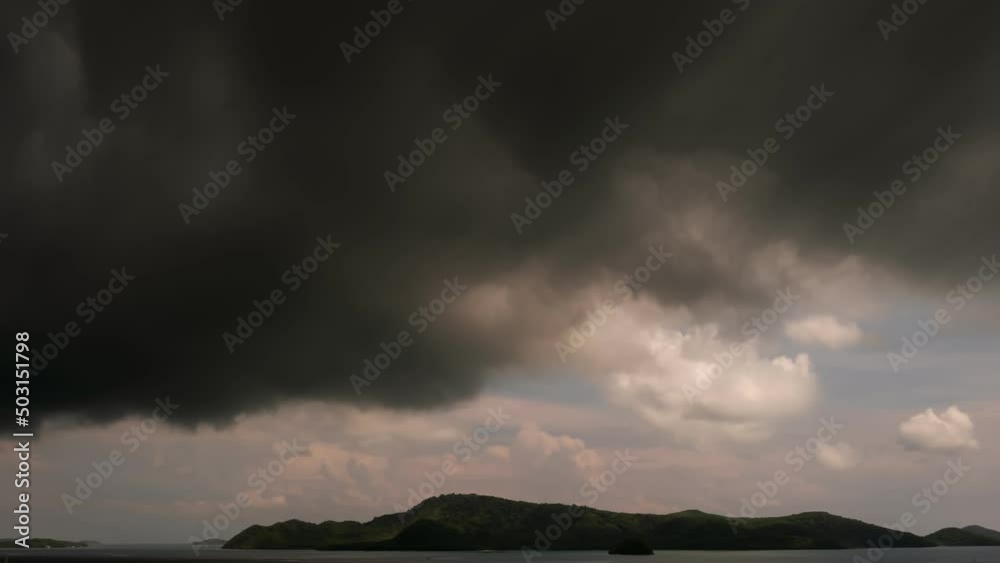 Building motions storm clouds.Dark clouds sky time lapse. Raining storm clouds over sea. Cloudscape timelapse Building motions storm clouds.Dark clouds sky time lapse. Raining storm clouds over sea. Cloudscape timelapse