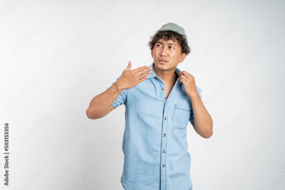 portrait of young asian man feeling the hot weather. hot weather portrait of young asian man feeling the hot weather. hot weather