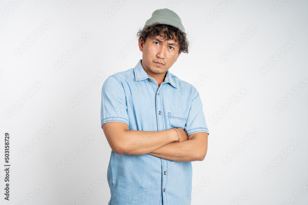 portrait of unsure asian young man thinking on isolated background portrait of unsure asian young man thinking on isolated background