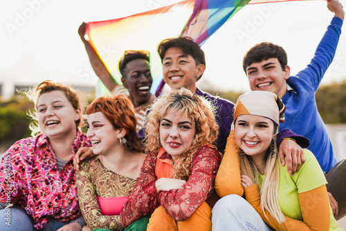 Young multiracial people celebrating together at LGBT pride parade
