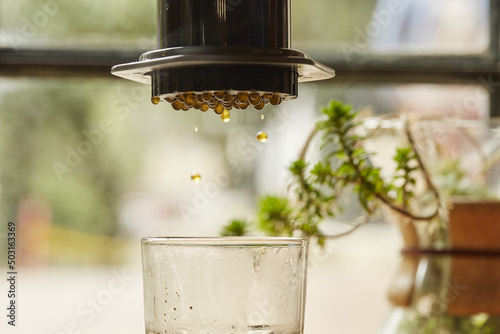 Selective focus shot of a pressure portable Minipress coffee maker photo