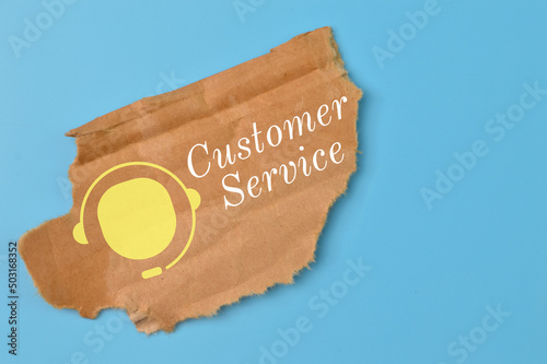 Brown paper torn with customer service symbol