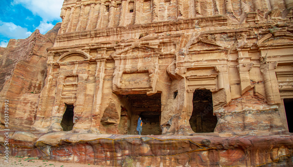 Woman poses as Petra in front of the temple