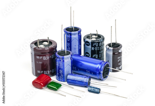 Group of capacitors different sizes isolated on white background.                        photo