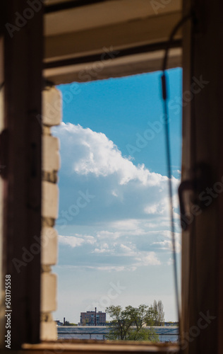 Clouds outside. Clouds through window. Fluffy clouds outside