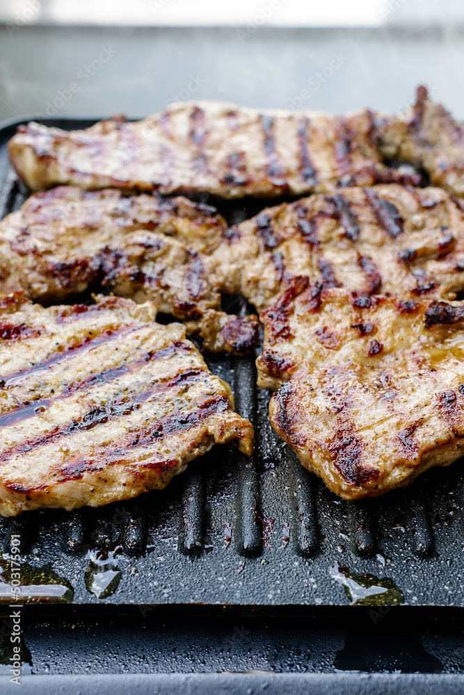 Barbecue with juicy pork neck steaks