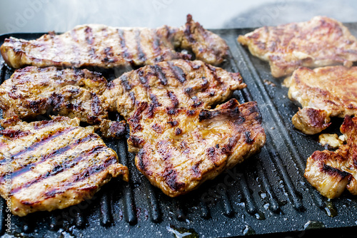 Barbecue with juicy pork neck steaks